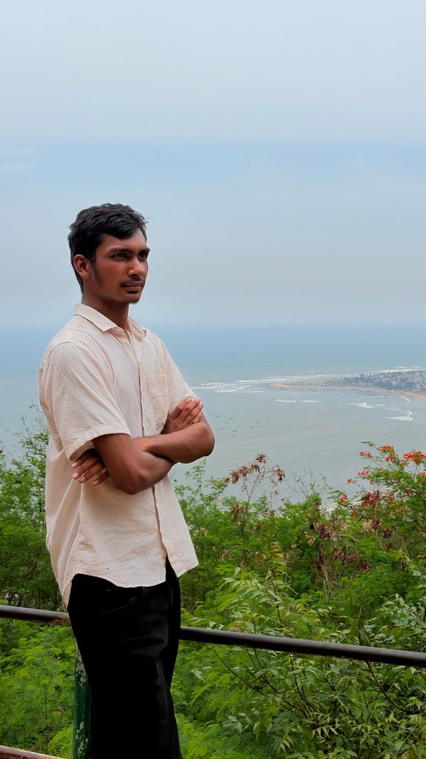 Nuthan at a hilltop viewpoint above the sea